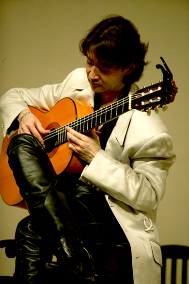 Shiro deals classical guitar